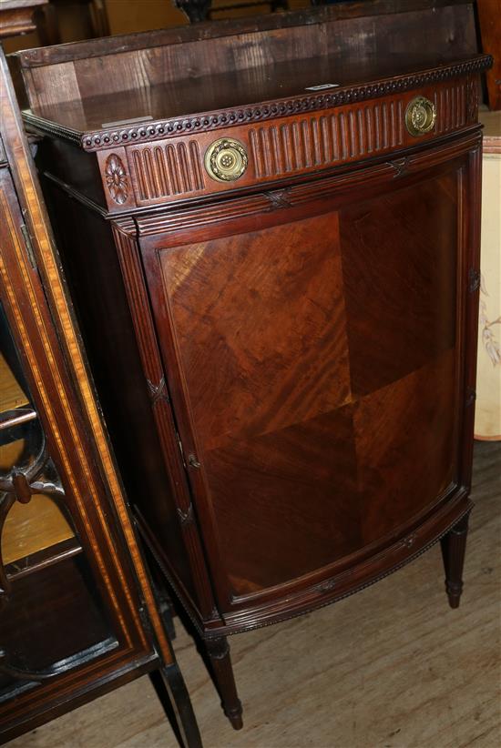 Louis XVI style mahogany bowfront cabinet(-)